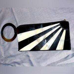 Sea Cove clutch- circle ring carry purse. Made out of sea shells. Never used.